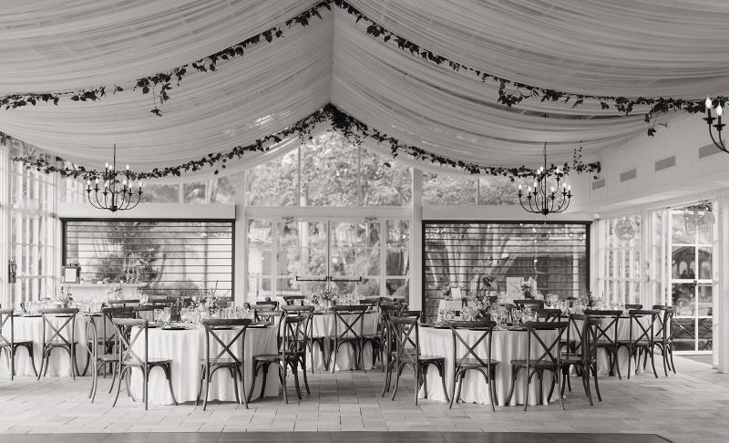 Table settings with plates, glasses, and cutlery at Cinco Farms Miami