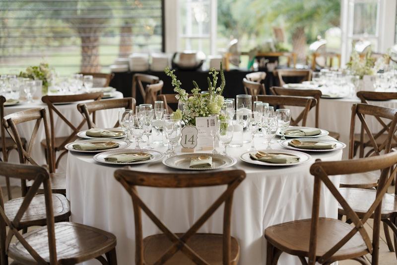 Table number cards with floral accents at Cinco Farms Miami