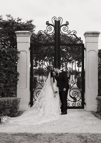 Groom looking at bride during Cinco Farms Miami portraits