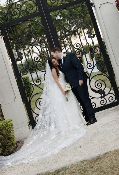 Bride looking at groom in garden at Cinco Farms Miami