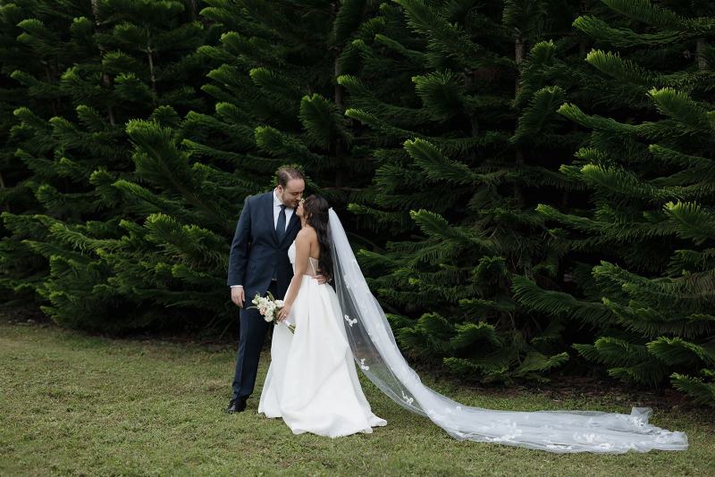 Couple embracing in front of Cinco Farms Miami scenery