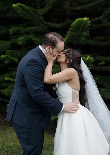 Couple embracing in front of Cinco Farms Miami scenery