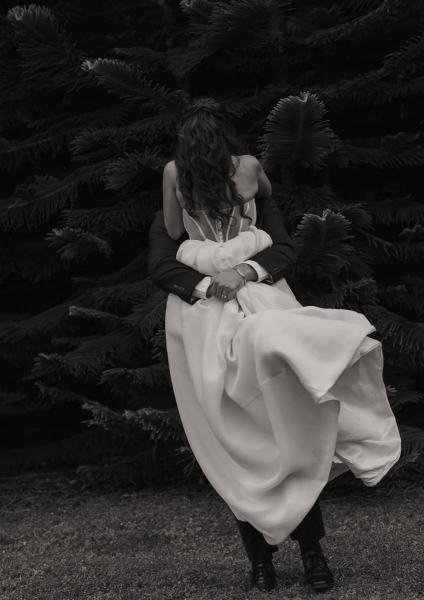 Bride and groom looking into each other’s eyes at Cinco Farms Miami