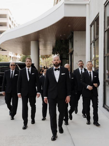 Groom and groomsmen standing in V-shape formation at The Ben Autograph Collection Hotel Palm Beach