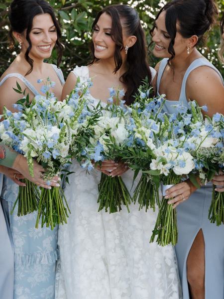 Bridesmaids standing together in dresses at Islamorada Fish Company Florida Keys