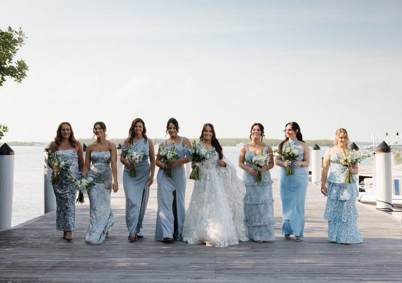 Bridesmaids standing together in dresses at Islamorada Fish Company Florida Keys