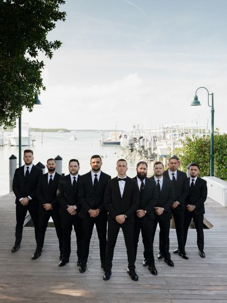 Wide shot of groomsmen with groom at Islamorada Fish Company Florida Keys