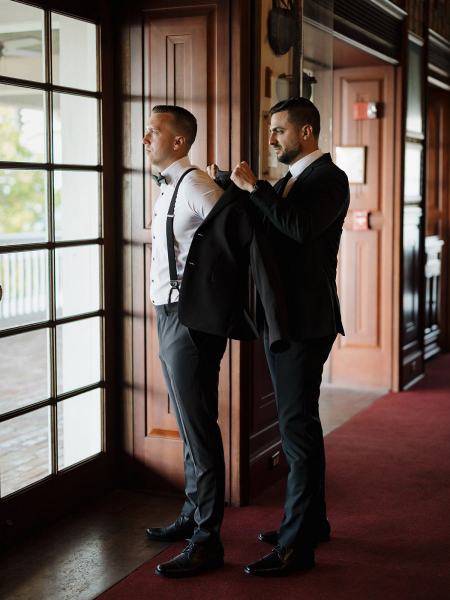 Wide shot of groomsmen with groom at Islamorada Fish Company Florida Keys