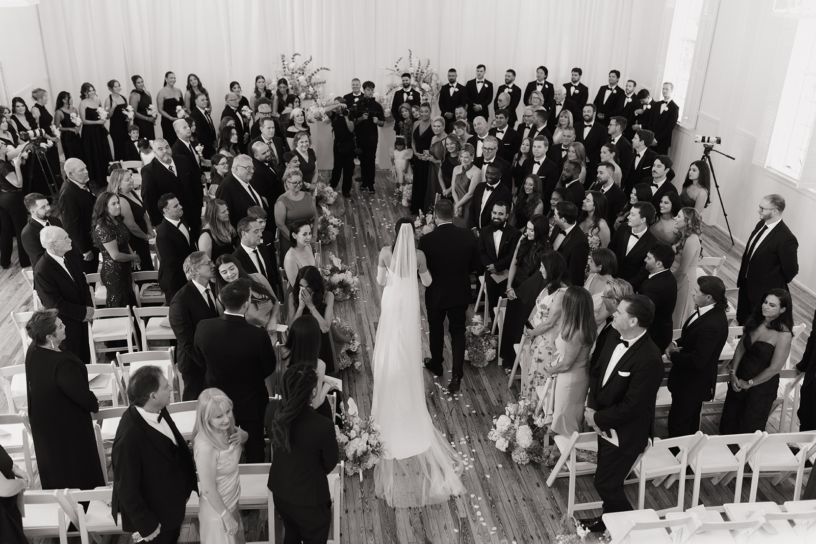 bride and groom walking down aisle in church